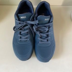 Blue sketchers sneakers